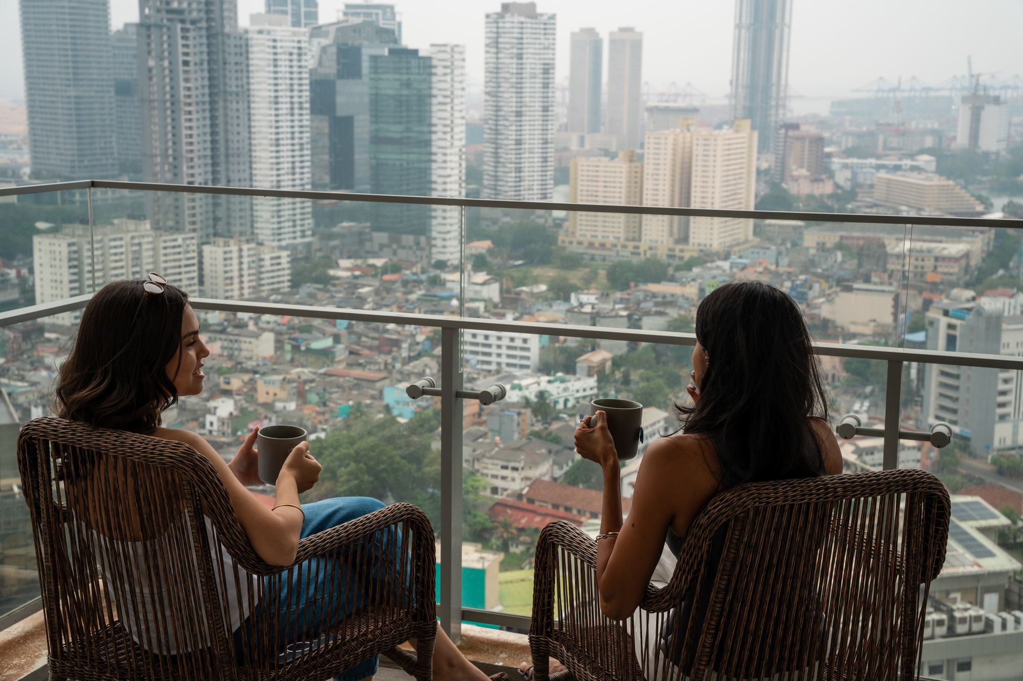 Guests enjoying morning tea on a HomeConnect balcony